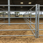 Durable livestock equipment featuring galvanized steel panels and connecting systems in covered Australian farm facility designed for long-term cattle management and containment.