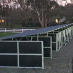 Cost-effective modular horse stable complex showing multiple stalls with galvanized construction and weather-resistant design for Australian conditions.