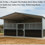A flat-pack horse stable with a grey metal roof and a two-tone design (grey upper, dark brown lower panels). It features a single stall with a metal gate and is built on a concrete pad in an outdoor setting. The image has overlaid, unreadable text.
