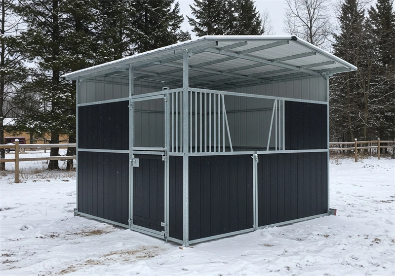DB Stable manufacturer showcases a portable horse stable kit installed in a snowy outdoor environment, featuring a hot-dip galvanized steel frame and durable HDPE panels. This durable, flat-pack structure is designed specifically for professional Equestrian Facilities and distributors in Australia and New Zealand.