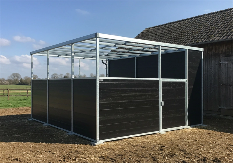 This image shows a DB Stable portable horse stable constructed with a hot-dip galvanized aluminum frame and durable black HDPE panels, designed for the Australian and New Zealand markets.