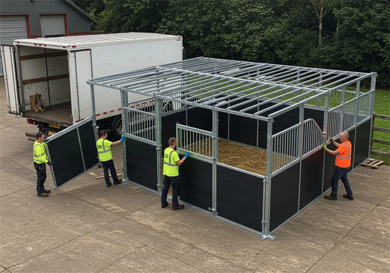 DB Stable technicians are assembling a modular frame featuring hot-dip galvanized steel and HDPE panels, showcasing the high-quality construction of our portable horse stables for ANZ distributors and equestrian facility owners.